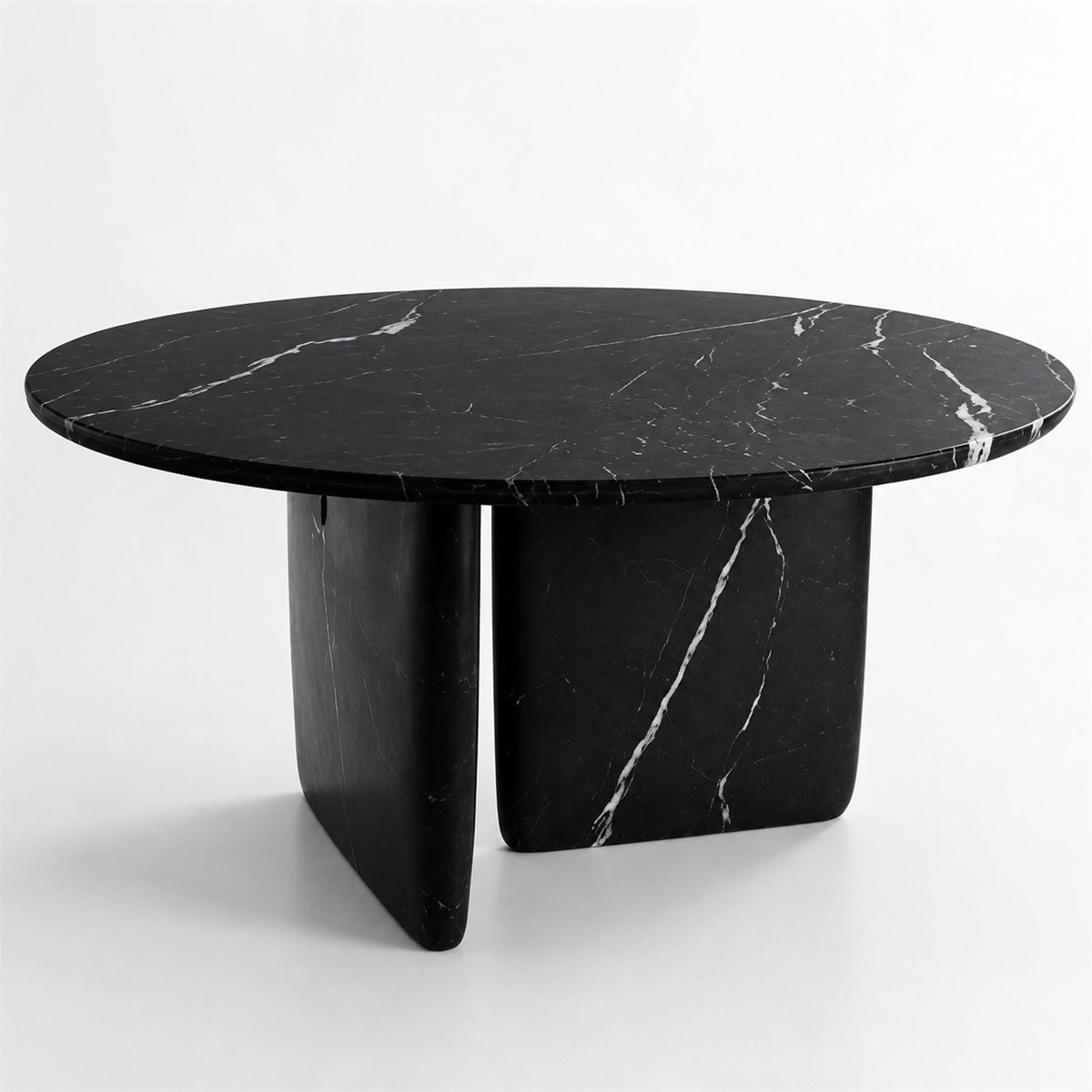 Black round stone table with white veins